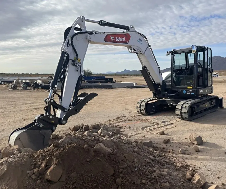 A Belco excavator digging on an Arizona jobsite